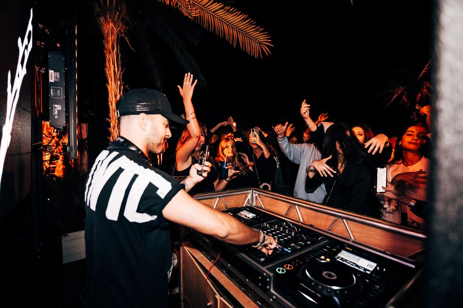 L.B.ONE mixing with the crowd dancing nearby