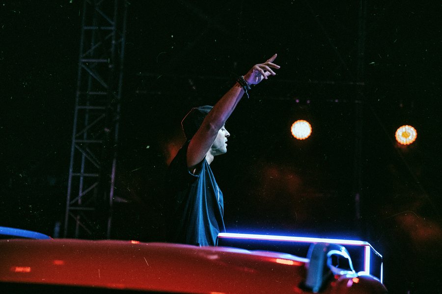 L.B.ONE raising his arm on stage